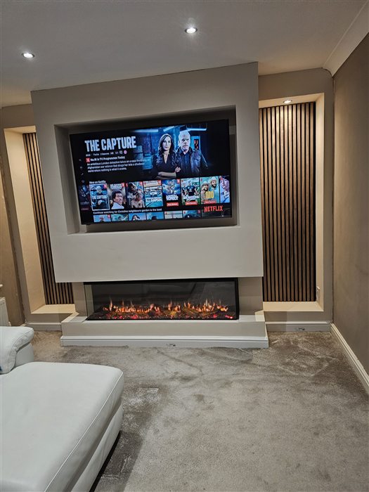 The finished media wall with TV recess, fire and slatted panels