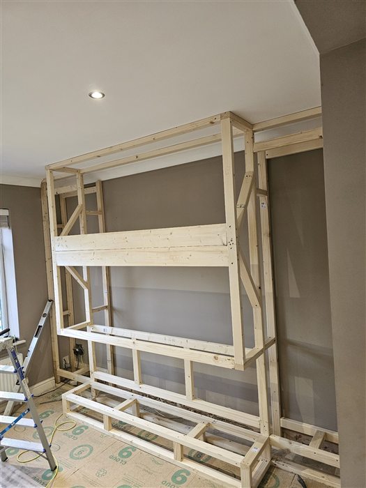 Timber frame for a media wall under construction