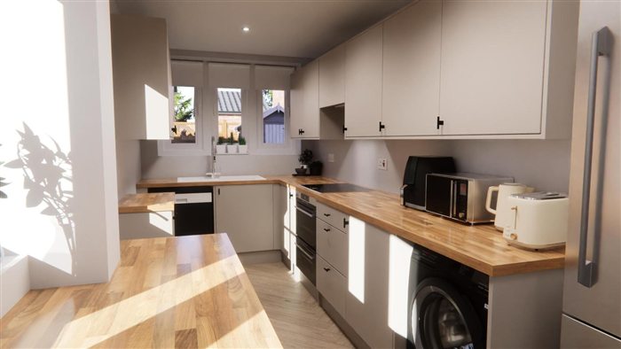 Kitchen with oak worktops and herringbone floor