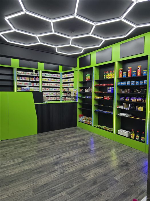 Shop fit-out with green shelving units