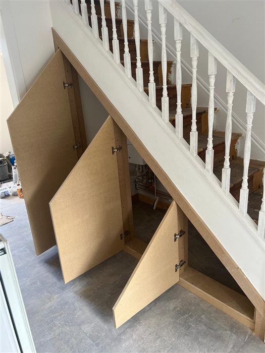 Oak-effect under-stairs cupboard doors